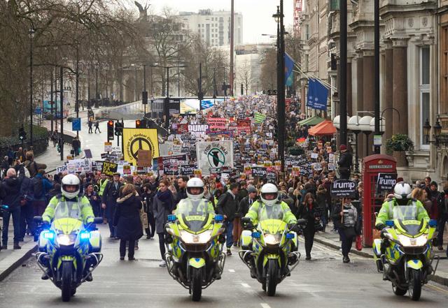 Demonstrators holding placards march in central London during a protest against Trump on Saturday. (AFP) Demonstrators holding placards march in central London during a protest against Trump on Saturday. (AFP)