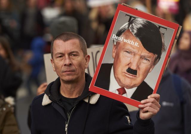 Demonstrators holding placards march in central London during a protest against US President Donald Trump. (AFP Photo) Demonstrators holding placards march in central London during a protest against US President Donald Trump. (AFP Photo)