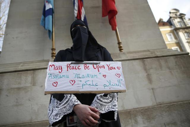 A demonstrator holds a placard during a march against U.S. President Donald Trump and his temporary ban on refugees and nationals from seven Muslim-majority countries. (REUTERS) A demonstrator holds a placard during a march against U.S. President Donald Trump and his temporary ban on refugees and nationals from seven Muslim-majority countries. (REUTERS)