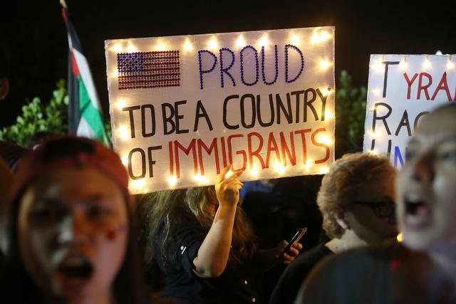 People protest against President Donald Trump as they gather at the entrance to the Mar-a-Lago Resort where he is staying for the weekend, in Palm Beach, Florida. (AFP Photo) People protest against President Donald Trump as they gather at the entrance to the Mar-a-Lago Resort where he is staying for the weekend, in Palm Beach, Florida. (AFP Photo)