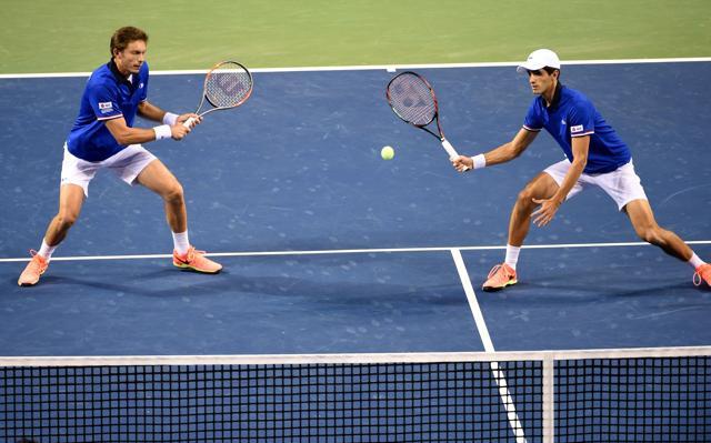 Wimbledon winners Pierre-Hugues Herbert and Nicolas Mahut brushed aside Yuichi Sugita and Yasutaka Uchiyama as France defeated Japan to enter the quarter-finals of the Davis Cup. (AFP) Wimbledon winners Pierre-Hugues Herbert and Nicolas Mahut brushed aside Yuichi Sugita and Yasutaka Uchiyama as France defeated Japan to enter the quarter-finals of the Davis Cup. (AFP)