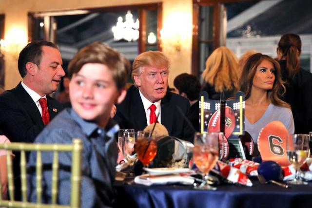 US President Donald Trump (C) and First Lady Melania watch the Super Bowl LI between New England Patriots and Atlanta Falcons at Trump International Golf club in West Palm Beach, Florida. (Reuters photo) US President Donald Trump (C) and First Lady Melania watch the Super Bowl LI between New England Patriots and Atlanta Falcons at Trump International Golf club in West Palm Beach, Florida. (Reuters photo)