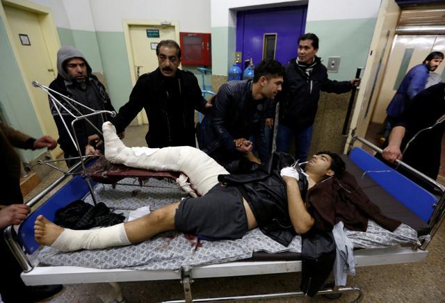 An injured man being carried to a hospital after the bomb blast in Kabul. (REUTERS) An injured man being carried to a hospital after the bomb blast in Kabul. (REUTERS)