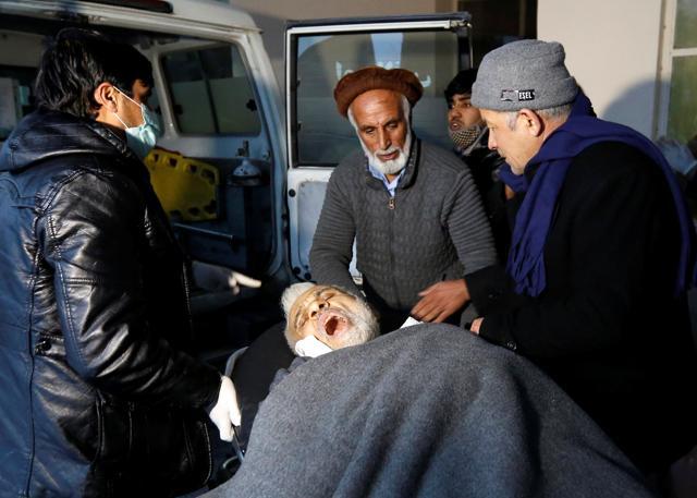 Men carry an injured man to a hospital after the bomb blast in Kabul. (REUTERS) Men carry an injured man to a hospital after the bomb blast in Kabul. (REUTERS)