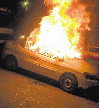 The car in flames. The car in flames.