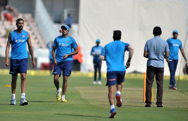 India's Ishant Sharma (L) and Ravichandran Ashwin (2L) prepare to bowl during a team practice session. (AFP)