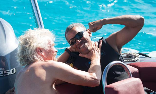 Former US President Barack Obama and British businessman Richard Branson sit on a boat during Obama's holiday on Branson's Moskito island, in the British Virgin Islands. (REUTERS) Former US President Barack Obama and British businessman Richard Branson sit on a boat during Obama's holiday on Branson's Moskito island, in the British Virgin Islands. (REUTERS)
