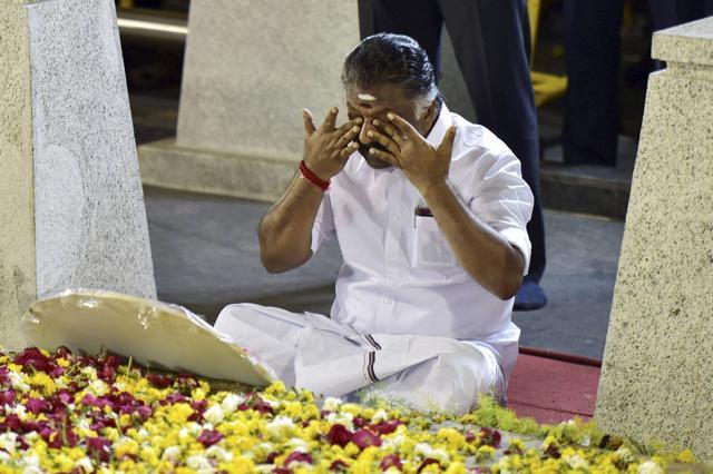 Tamil Nadu chief minister O Panneerselvam medidates in front of late J Jayalalithaa's burial site at the Marina Beach in Chennai on Tuesday. (PTI Photo) Tamil Nadu chief minister O Panneerselvam medidates in front of late J Jayalalithaa's burial site at the Marina Beach in Chennai on Tuesday. (PTI Photo)