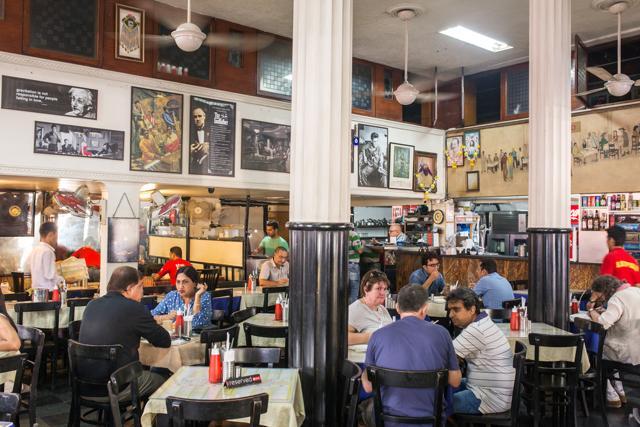 In Mumbai, Karmakar looks at the more famous Leopold Cafe (in picture), Cafe Churchill and Cafe Mondegar, but his love for Iranian restaurants strewn across the city comes across as heartfelt (Shutterstock) In Mumbai, Karmakar looks at the more famous Leopold Cafe (in picture), Cafe Churchill and Cafe Mondegar, but his love for Iranian restaurants strewn across the city comes across as heartfelt (Shutterstock)