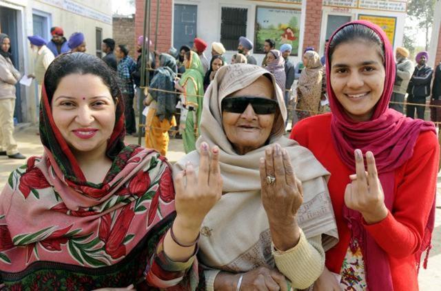 Women show their inked fingers after casting their vote at Govt Ranbir College in Sangrur on Thursday. (Bharat Bhushan/HT ) Women show their inked fingers after casting their vote at Govt Ranbir College in Sangrur on Thursday. (Bharat Bhushan/HT )