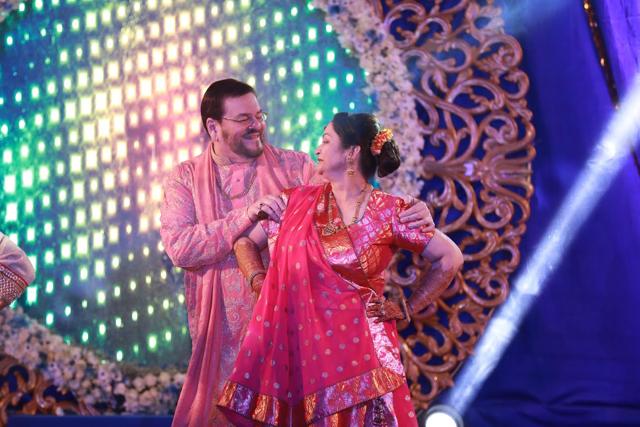 Neil’s mom and dad enjoy during the sangeet. (The Wedding Story) Neil’s mom and dad enjoy during the sangeet. (The Wedding Story)
