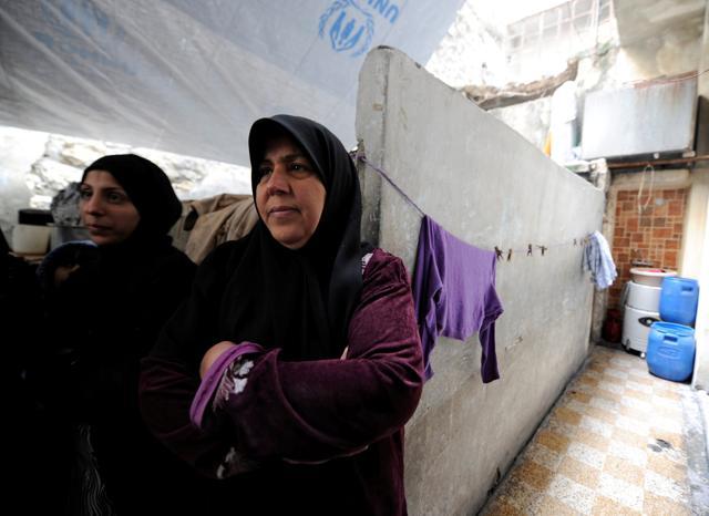 Heyam Batash (R), 56, stands with her daughter at her house in al-Mouassassi street in Aleppo, Syria, January 30, 2017. Picture taken January 30. (REUTERS) Heyam Batash (R), 56, stands with her daughter at her house in al-Mouassassi street in Aleppo, Syria, January 30, 2017. Picture taken January 30. (REUTERS)