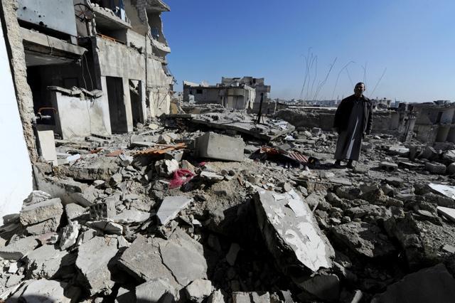 Eymad, 54, stands on the rubble of the damaged rooftop of his house at al-Mouassassi street in Aleppo, Syria, February 2. (REUTERS) Eymad, 54, stands on the rubble of the damaged rooftop of his house at al-Mouassassi street in Aleppo, Syria, February 2. (REUTERS)