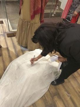 Delhi Court’s appointed commissioner sealing the copied outfit. (HT Photo) Delhi Court’s appointed commissioner sealing the copied outfit. (HT Photo)
