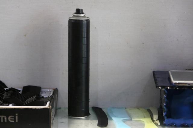 A spray can used by Odwan to create flames while straightening and styling his customers' hair. (Reuters Photo)