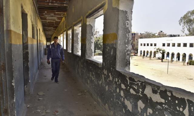 The dilapidated building of the the Government Girls/Boys Senior Secondary School at Shahbad Dairy. After the building was declared dangerous last year, the students had to be shifted to another school in Pul Prehladpur. (Sushil Kumar/HT Photo) The dilapidated building of the the Government Girls/Boys Senior Secondary School at Shahbad Dairy. After the building was declared dangerous last year, the students had to be shifted to another school in Pul Prehladpur. (Sushil Kumar/HT Photo)
