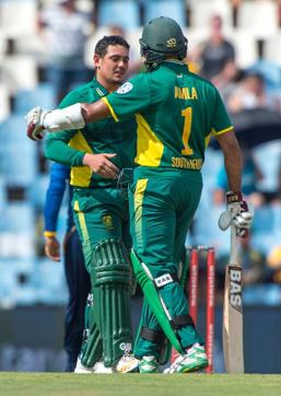 Quinton de Kock (L) is congratulated by South African cricketer Hashim Amla after getting his hundred during the fifth and last ODI between South Africa and Sri Lanka in Centurion on Friday. (AFP) Quinton de Kock (L) is congratulated by South African cricketer Hashim Amla after getting his hundred during the fifth and last ODI between South Africa and Sri Lanka in Centurion on Friday. (AFP)
