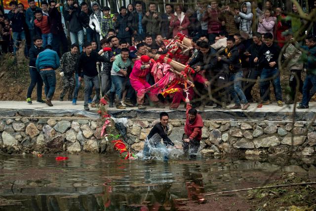 The religious ceremony held Friday in Yuxi village is one of many in the run-up to the traditional Lantern Festival, which falls on February 11 this year. (AFP) The religious ceremony held Friday in Yuxi village is one of many in the run-up to the traditional Lantern Festival, which falls on February 11 this year. (AFP)