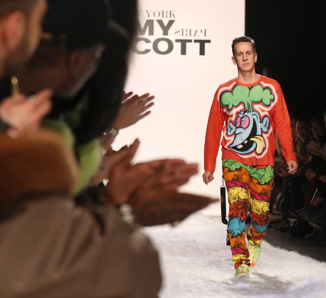 Fashion designer Jeremy Scott walks the runway to applause after showing his latest collection during NY Fashion Week, on Feb 10. (AP Photo)