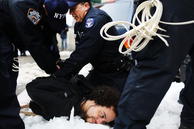 A demonstrator is arrested during a protest and march against the immigration polices of President Donald Trump and other issues on February 11, 2017 in New York City. (AFP) A demonstrator is arrested during a protest and march against the immigration polices of President Donald Trump and other issues on February 11, 2017 in New York City. (AFP)