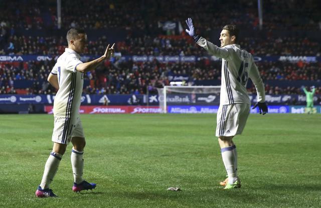Real Madrid's Lucas Vazquez (L) celebrates with team mate Mateo Kovacic after scoring against Osasuna. (REUTERS) Real Madrid's Lucas Vazquez (L) celebrates with team mate Mateo Kovacic after scoring against Osasuna. (REUTERS)