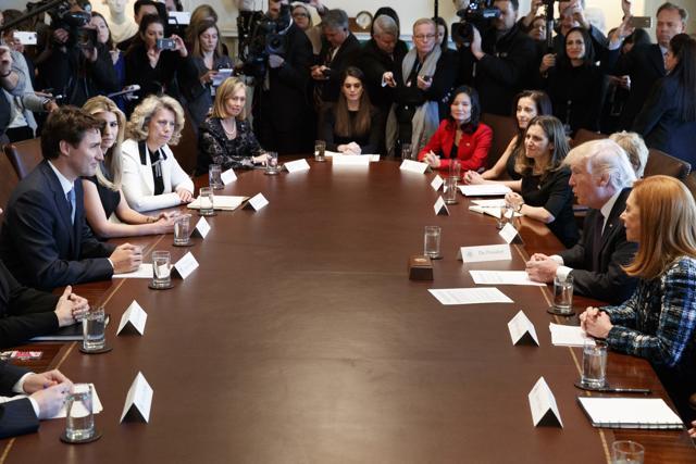 President Donald Trump and Canadian Prime Minister Justin Trudeau host a meeting with women business leaders in the Cabinet Room of the White House in Washington, Monday. (AP Photo)