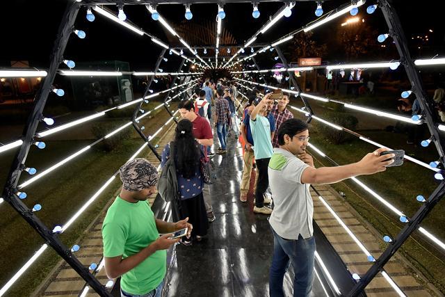 People take selfies against an installation during the inauguration ceremony of the recent Hindustan Times Kala Ghoda Art Festival in Mumbai. (Arijit Sen/HT Photo)