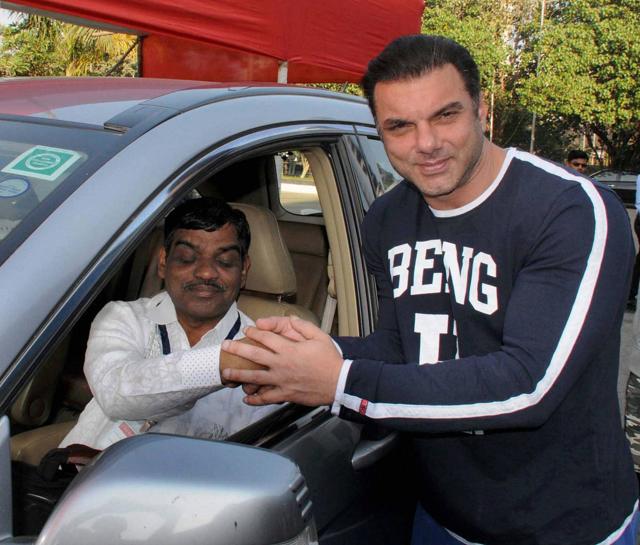 A physically challenged participant along with Bollywood producer and actor Sohail Khan during the 11th edition car rally for blinds at National Sports Club in South Mumbai on Sunday. (PTI) A physically challenged participant along with Bollywood producer and actor Sohail Khan during the 11th edition car rally for blinds at National Sports Club in South Mumbai on Sunday. (PTI)