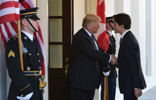 US President Donald Trump (L) greets Canada's Prime Minister Justin Trudeau upon arrival outside of the West Wing of the White House on February 13 in Washington, DC. (AFP Photo)