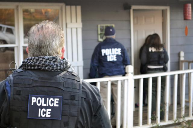 ICE agents at a home in Atlanta, during a targeted enforcement operation aimed at immigration fugitives. (AP Photo) ICE agents at a home in Atlanta, during a targeted enforcement operation aimed at immigration fugitives. (AP Photo)