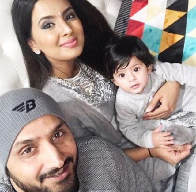 Hinaya Heer Plaha looks on as her parents click a selfie with her celebrating her first Lohri. (instagram.com/geetabasra)