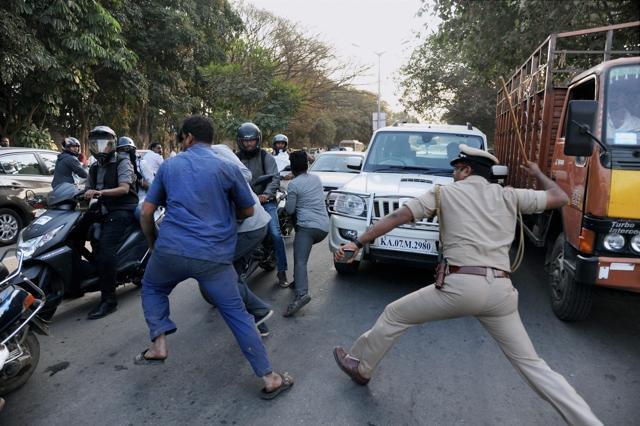 Police baton-charge AIADMK supporters as party general secretary VK Sasikala arrives to surrender in Bengaluru on Wednesday. (PTI) Police baton-charge AIADMK supporters as party general secretary VK Sasikala arrives to surrender in Bengaluru on Wednesday. (PTI)