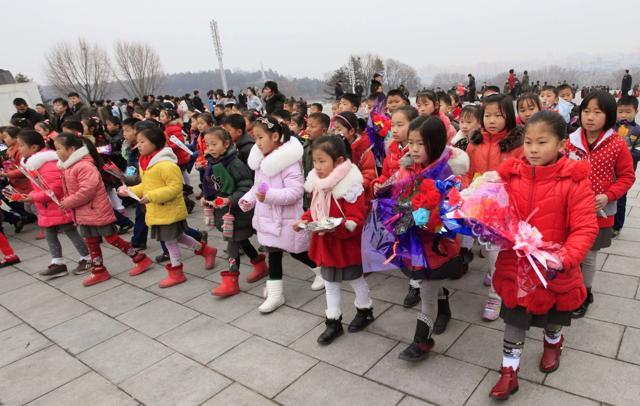 Schoolchildren with offerings walk toward statues of late North Korean leaders Kim Il Sung and Kim Jong Il to pay tribute, in Pyongyang, North Korea. (AP) Schoolchildren with offerings walk toward statues of late North Korean leaders Kim Il Sung and Kim Jong Il to pay tribute, in Pyongyang, North Korea. (AP)