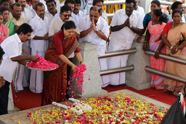 AIADMK general secretary VK Sasikala offers floral tributes at J Jayalalithaa's memorial at the Marina beach in Chennai before leaving for Bengaluru to surrender on Wednesday. (PTI) AIADMK general secretary VK Sasikala offers floral tributes at J Jayalalithaa's memorial at the Marina beach in Chennai before leaving for Bengaluru to surrender on Wednesday. (PTI)