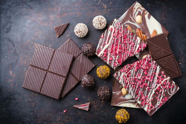 Titanium dioxide is used in some chocolates to give it a smooth texture; in donuts to provide colour; and in skimmed milks for a brighter, more opaque appearance which makes the milk more palatable (Shutterstock)