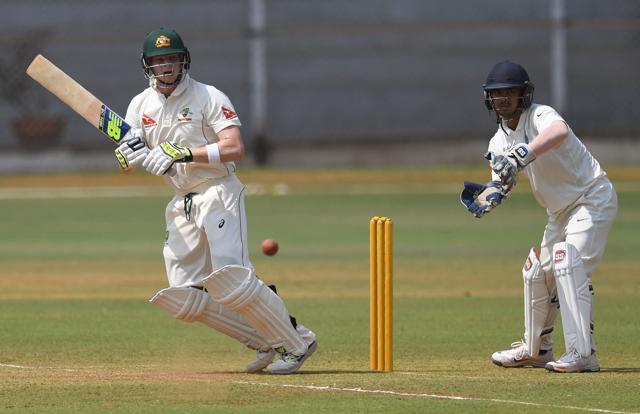 Australia's captain Steve Smith (L) plays a shot as India 'A' wicketkeeper Ishan Kishan looks on. (AFP) Australia's captain Steve Smith (L) plays a shot as India 'A' wicketkeeper Ishan Kishan looks on. (AFP)