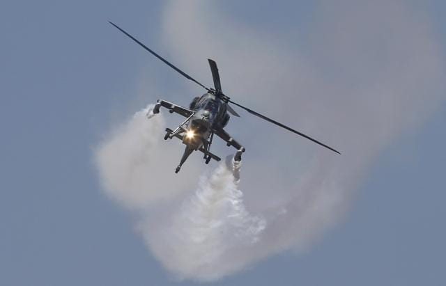 Indigenously manufactured Dhruv helicopter performs on the second day of Aero India 2017 at Yelahanka air base in Bangalore, February 15, 2017.The air show comes a fortnight after India allocated Rs 2.74 lakh crore for defence spending through 2017-18, a marginal increase over last year’s budget of Rs 2.58 lakh crore. The spending includes Rs 86,488 crore for the military’s modernisation. (AIJAZ RAHI / AP) Indigenously manufactured Dhruv helicopter performs on the second day of Aero India 2017 at Yelahanka air base in Bangalore, February 15, 2017.The air show comes a fortnight after India allocated Rs 2.74 lakh crore for defence spending through 2017-18, a marginal increase over last year’s budget of Rs 2.58 lakh crore. The spending includes Rs 86,488 crore for the military’s modernisation. (AIJAZ RAHI / AP)