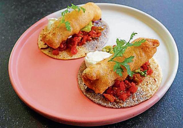 The Baja fish tacos with pico de gallo, tart cream, guacamole, and a tortilla page are as tasty as they are camera-friendly. (Prodip Guha/HT Photo)