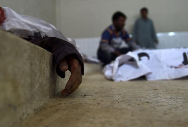 Pakistani volunteers stand beside the bodies of suspected militants killed in an overnight raid on their hideouts by security forces as they lie in a mortuary in Karachi on February 17, 2017. (AFP) Pakistani volunteers stand beside the bodies of suspected militants killed in an overnight raid on their hideouts by security forces as they lie in a mortuary in Karachi on February 17, 2017. (AFP)
