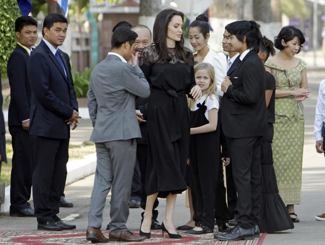 Angelina Jolie, center, stands with her group members as they wait before meeting Cambodia's King Norodom Sihamoni, in Siem Reap. (AP) Angelina Jolie, center, stands with her group members as they wait before meeting Cambodia's King Norodom Sihamoni, in Siem Reap. (AP)