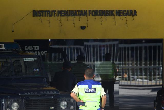 A police officer stands at the morgue at Kuala Lumpur General Hospital where Kim Jong Nam's body is held for autopsy in Malaysia. (REUTERS) A police officer stands at the morgue at Kuala Lumpur General Hospital where Kim Jong Nam's body is held for autopsy in Malaysia. (REUTERS)