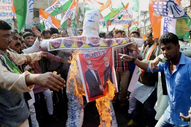 Congress activists burning an effigy during a protest in Bhopal against alleged involvement of BJP leaders in espionage. (PTI) Congress activists burning an effigy during a protest in Bhopal against alleged involvement of BJP leaders in espionage. (PTI)