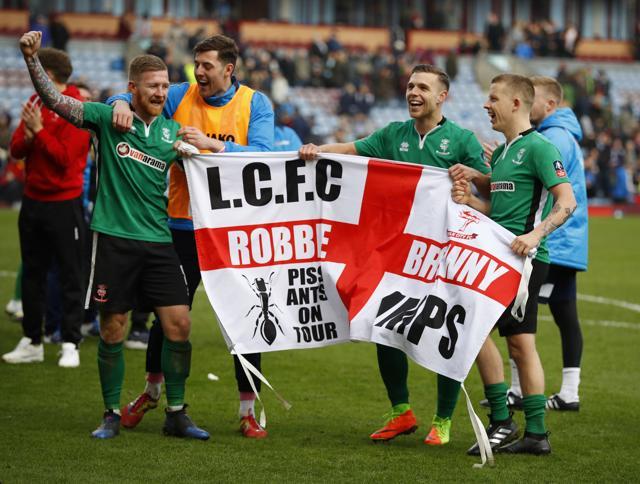 Lincoln City's Alan Power, Terry Hawkridge and teammates celebrate after the match. (REUTERS) Lincoln City's Alan Power, Terry Hawkridge and teammates celebrate after the match. (REUTERS)