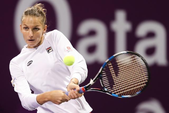 Karolina Pliskova of the Czech Republic returns a ball to Dominika Cibulkova of Slovakia. (AFP)