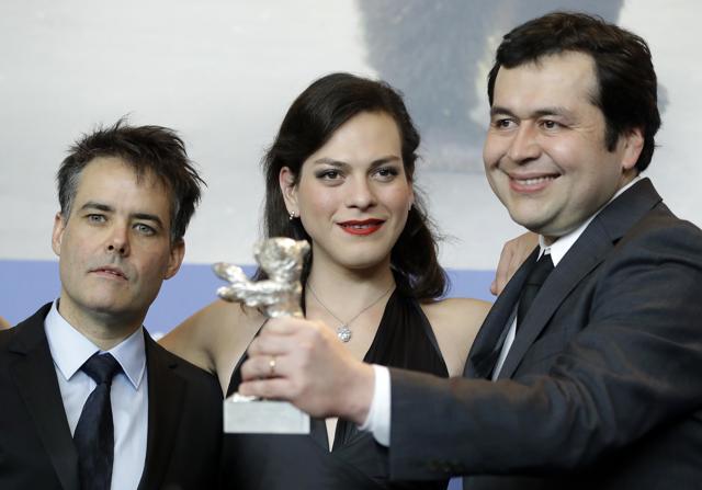 From left, director Sebastian Lelio, actress Daniela Vega and writer Gonzalo Maza pose for the photographers with their Best Screenplay silver bear for the film A Fantastic Woman. (AP) From left, director Sebastian Lelio, actress Daniela Vega and writer Gonzalo Maza pose for the photographers with their Best Screenplay silver bear for the film A Fantastic Woman. (AP)