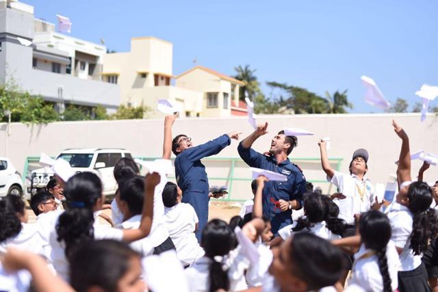 Dylan and James fly paper planes after a workshop with school children, during their India tour. Dylan and James fly paper planes after a workshop with school children, during their India tour.