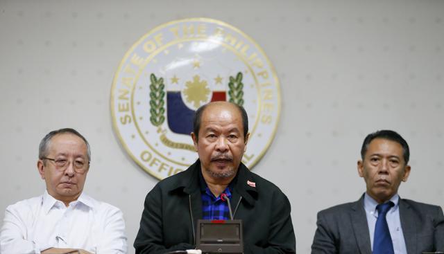 Flanked by lawyers Arno Sanidad (left) and Jose Manuel Diokno (right) retired police officer Arthur Lascanas at a news conference at the Philippine Senate in suburban Pasay city, Philippines, on February 20, 2017. Lascanas said President Rodrigo Duterte ordered and paid him and other members of a covert squad to kill criminals and opponents, when he was a city mayor. (AP) Flanked by lawyers Arno Sanidad (left) and Jose Manuel Diokno (right) retired police officer Arthur Lascanas at a news conference at the Philippine Senate in suburban Pasay city, Philippines, on February 20, 2017. Lascanas said President Rodrigo Duterte ordered and paid him and other members of a covert squad to kill criminals and opponents, when he was a city mayor. (AP)