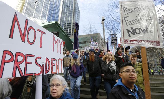 Protesters march down the steps of the federal courthouse in Seattle where a hearing was held for a Seattle-area man who was arrested by immigration agents despite his participation in a federal program to protect those brought to the US illegally as children. (AP Photo) Protesters march down the steps of the federal courthouse in Seattle where a hearing was held for a Seattle-area man who was arrested by immigration agents despite his participation in a federal program to protect those brought to the US illegally as children. (AP Photo)
