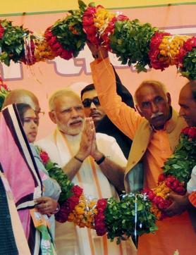 Prime Minister Narendra Modi garlanded at an election rally at Jalaun district on Monday. (PTI) Prime Minister Narendra Modi garlanded at an election rally at Jalaun district on Monday. (PTI)