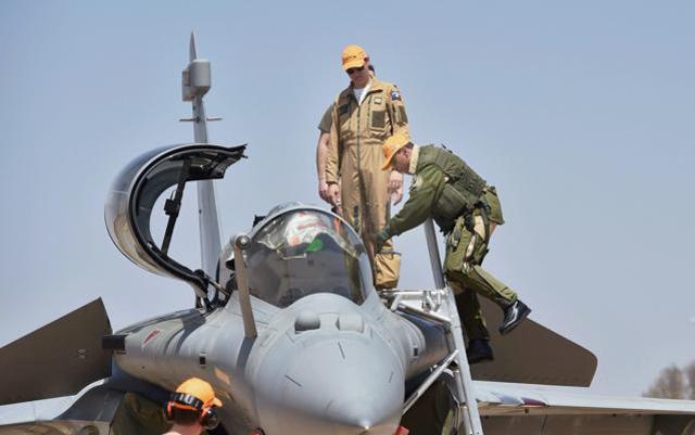 Reliance Group chairman Anil Ambani climbs in the cockpit of Rafale aircraft for a sortie. (PTI Photo) Reliance Group chairman Anil Ambani climbs in the cockpit of Rafale aircraft for a sortie. (PTI Photo)